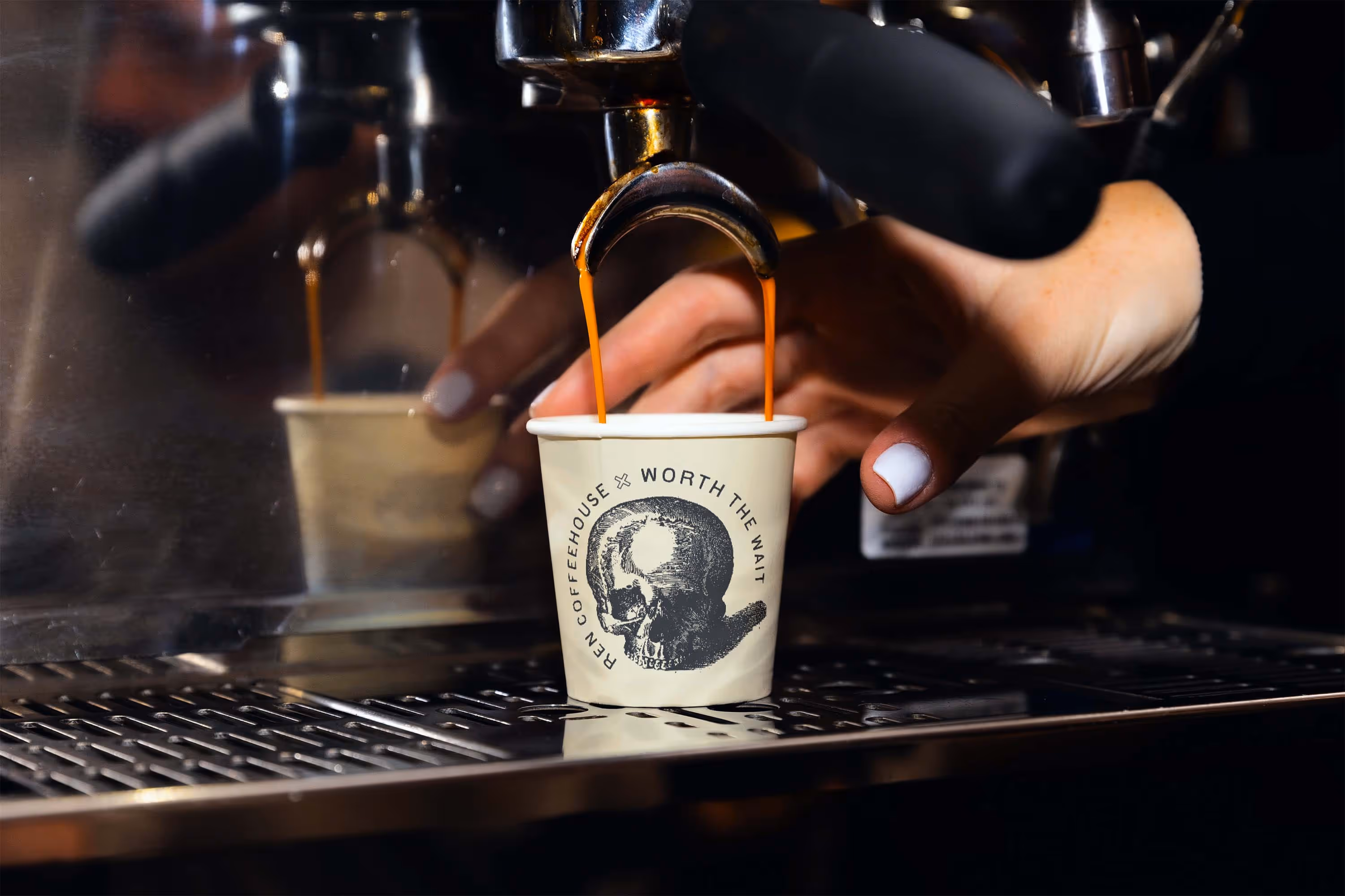 espresso machine with coffee cup and barista