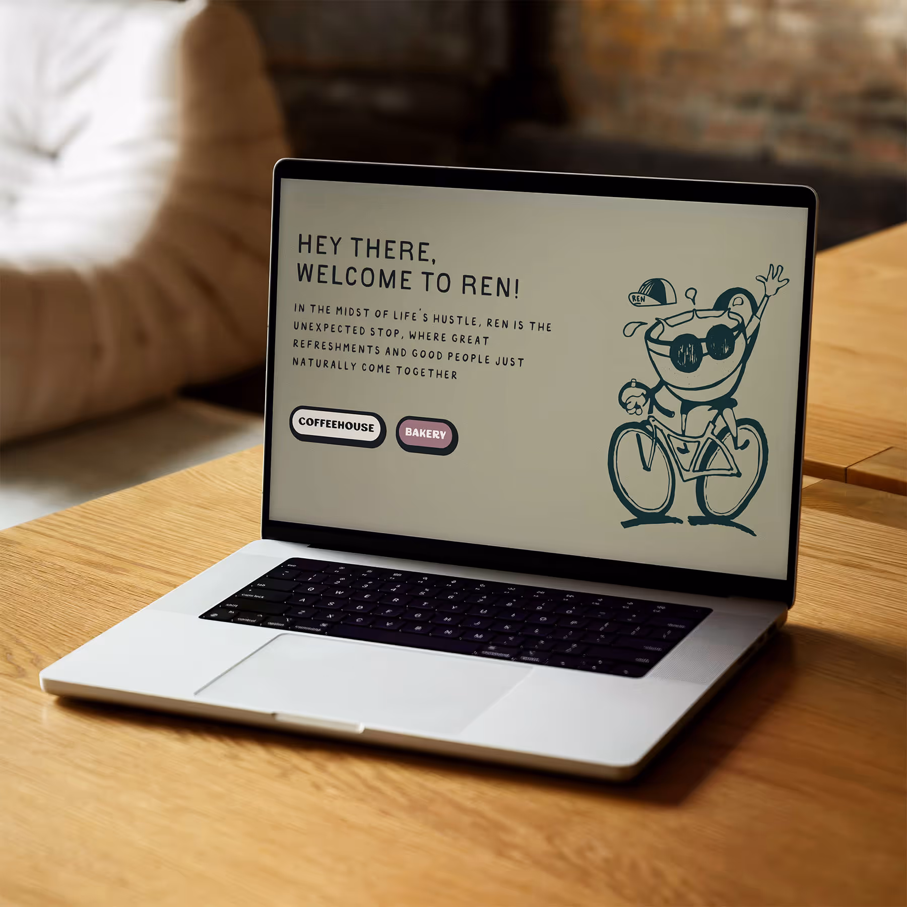 computer on wooden table displaying website
