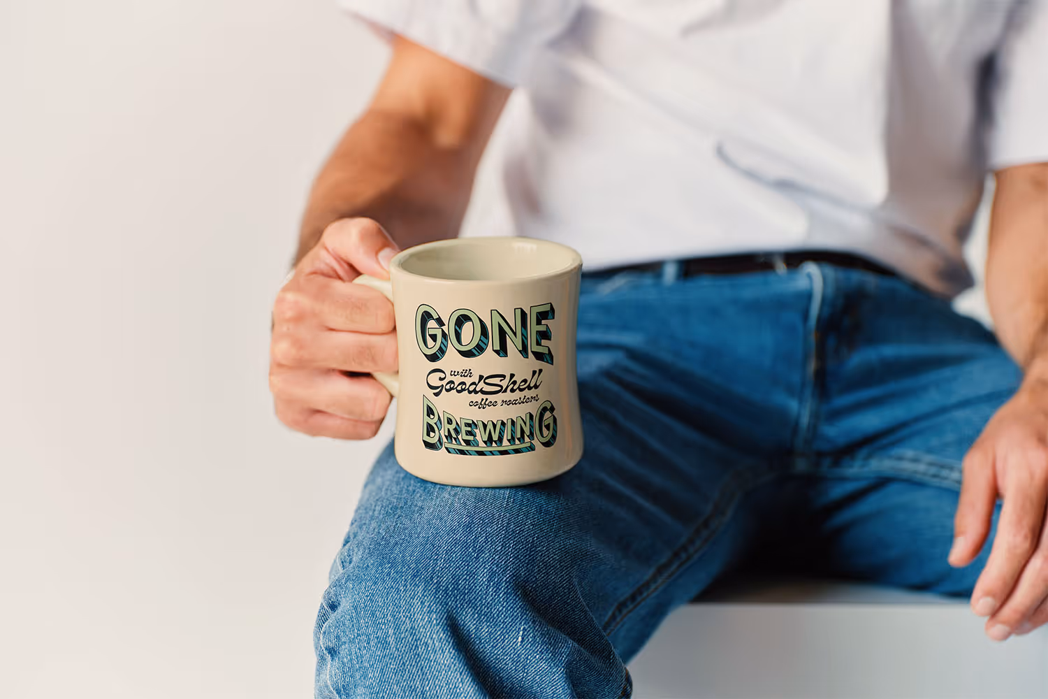 man holding coffee mug