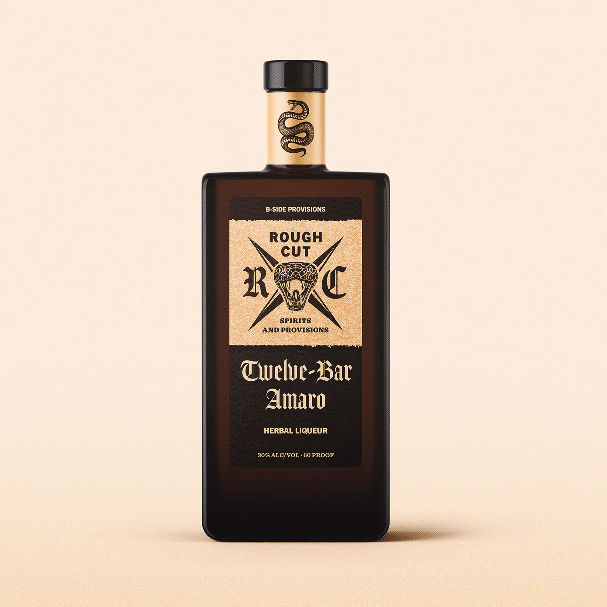 Dark rectangular bottle with a beige label featuring a snake design and the text Rough Cut RC Spirits and Provisions, Twelve-Bar Amaro Herbal Liqueur, and 30% ALC/VOL 60 PROOF.