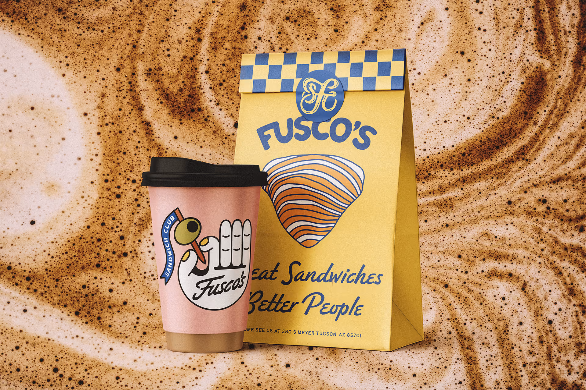 Hot cup packaging in pink and bakery to-go bag in yellow colorway