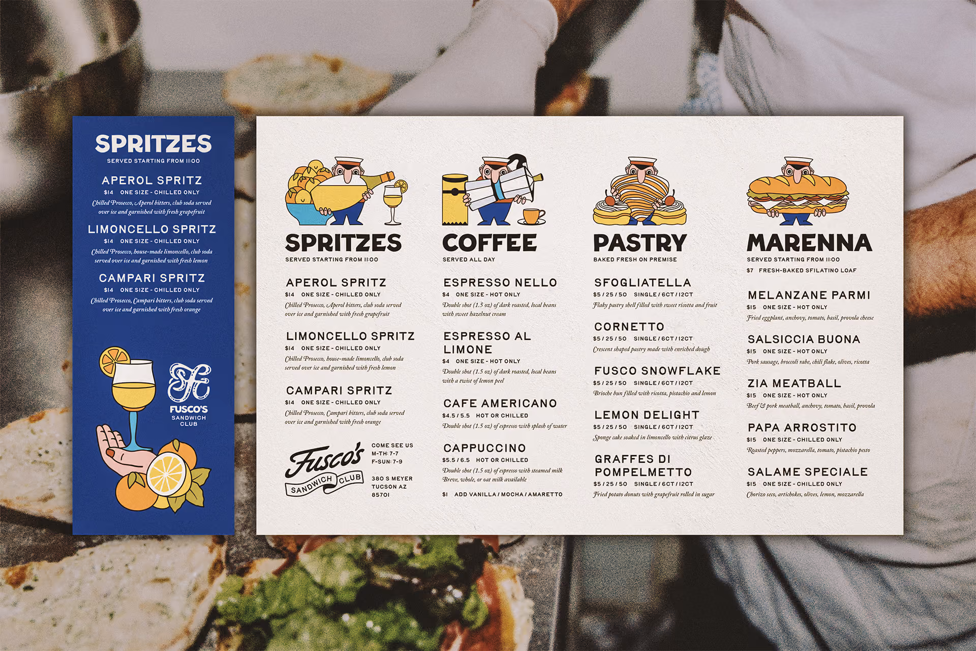 Large paper menu with a deep blue table tent flyer