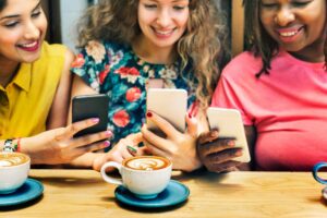 Three women networking while playing poker on the Poker Power Play App