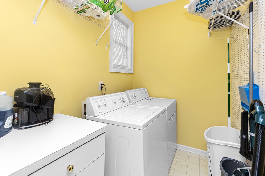 Bright residential laundry room with a washer and dryer
