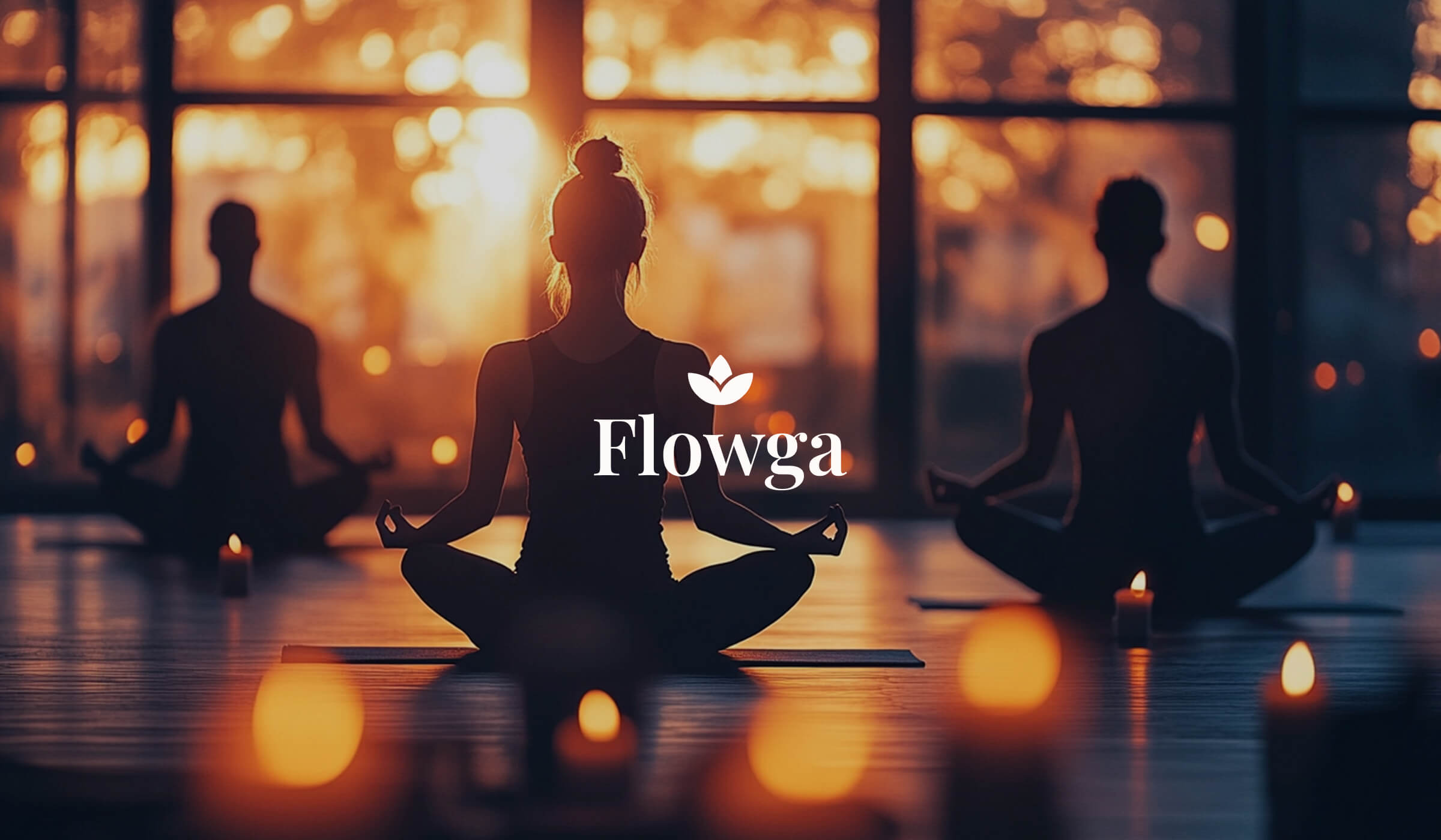 Yoga students meditating at sunrise in candlelit studio – Flowga brand design