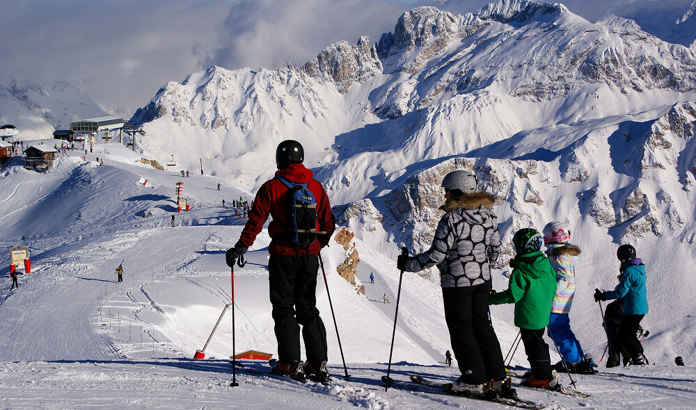 Family skiing on a snowy mountain — hero imagery for the HealthCore Chiropractic & Rehab website project in Redmond, Oregon.