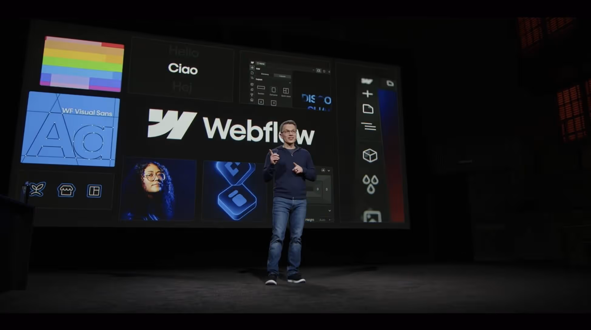 Person standing before LED screen from Webflow Conf 2023
