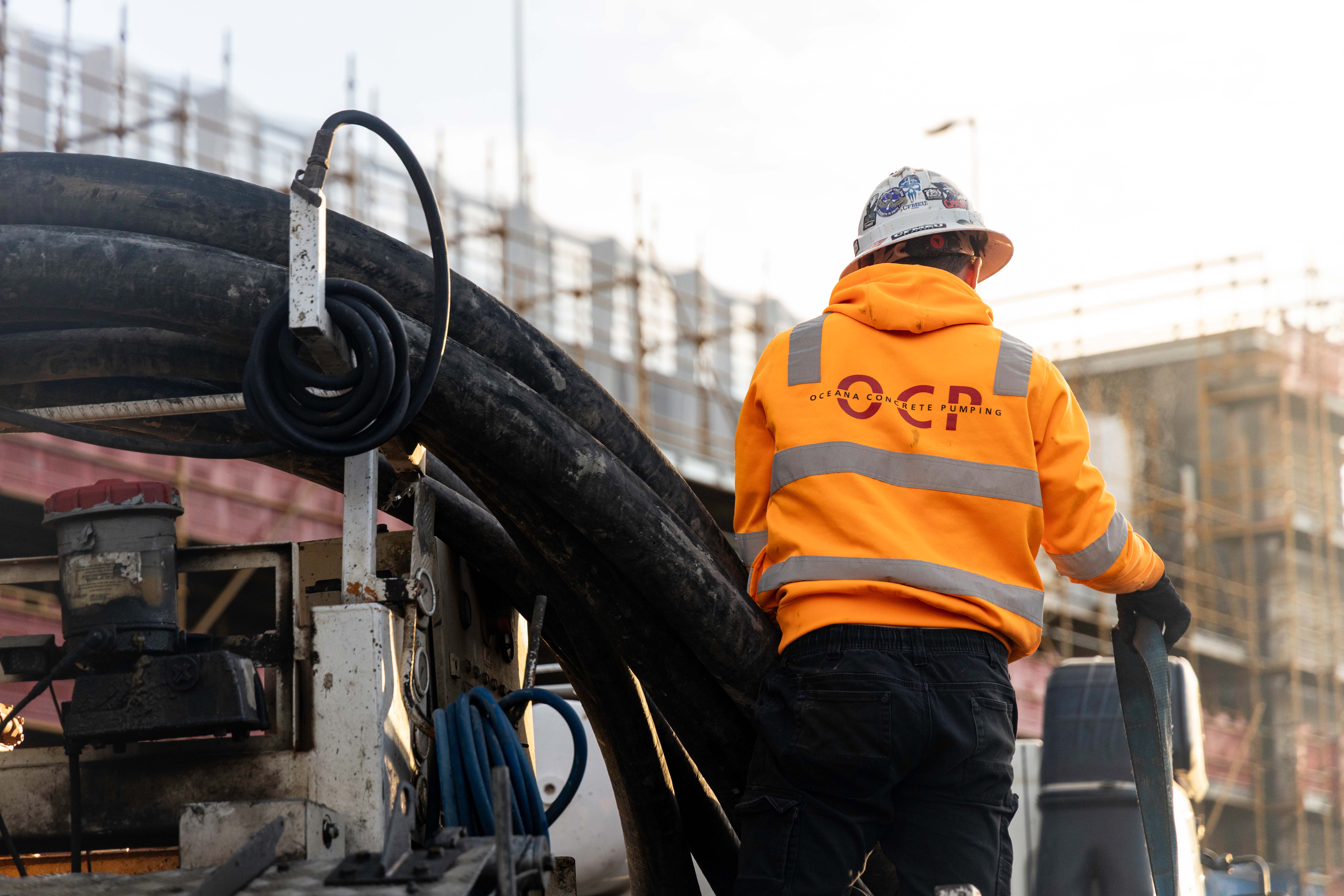 Oceana Concrete Pumping crew members working safely on a construction site in Melbourne.