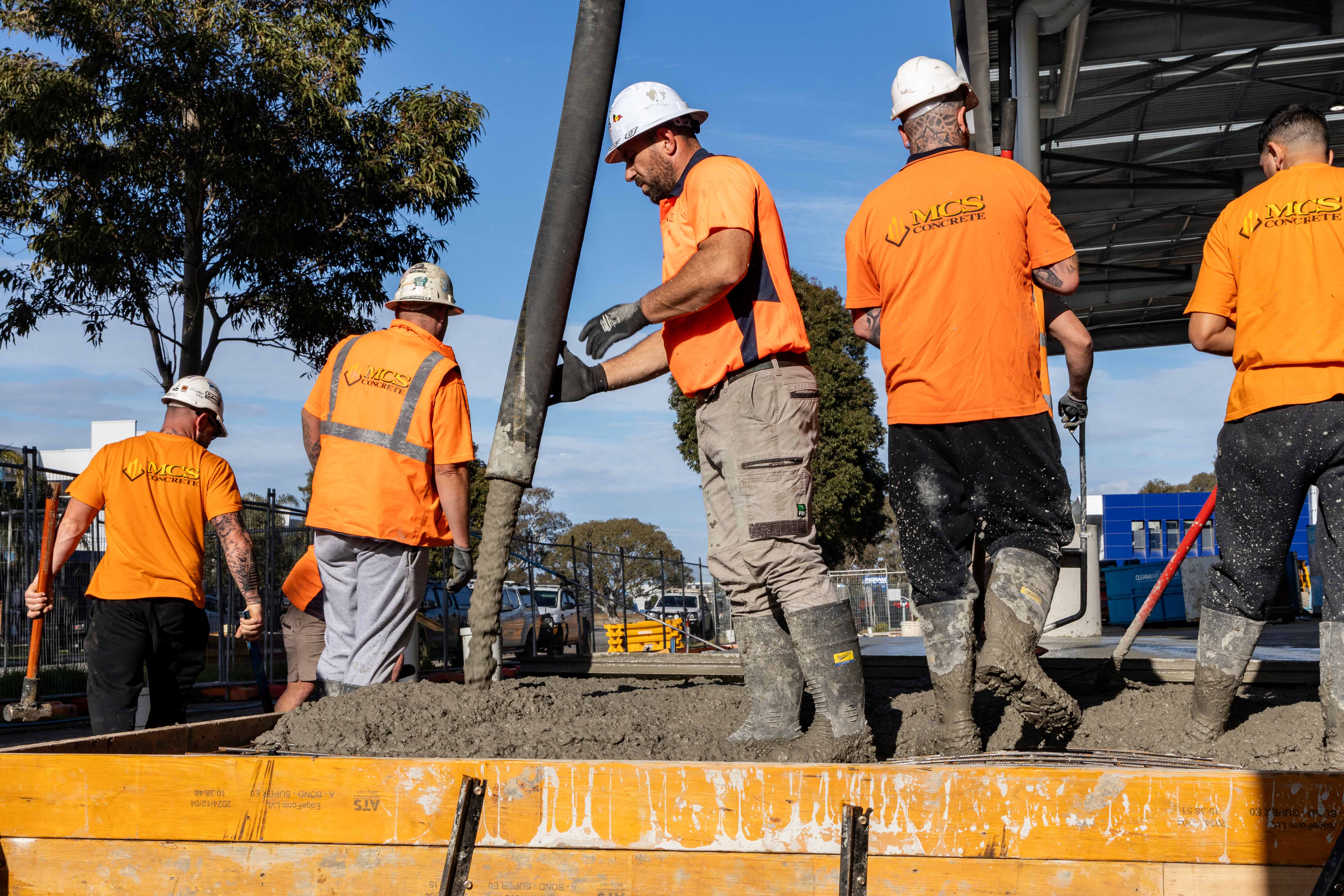Oceana Concrete Pumping crew members working safely on a construction site in Melbourne.