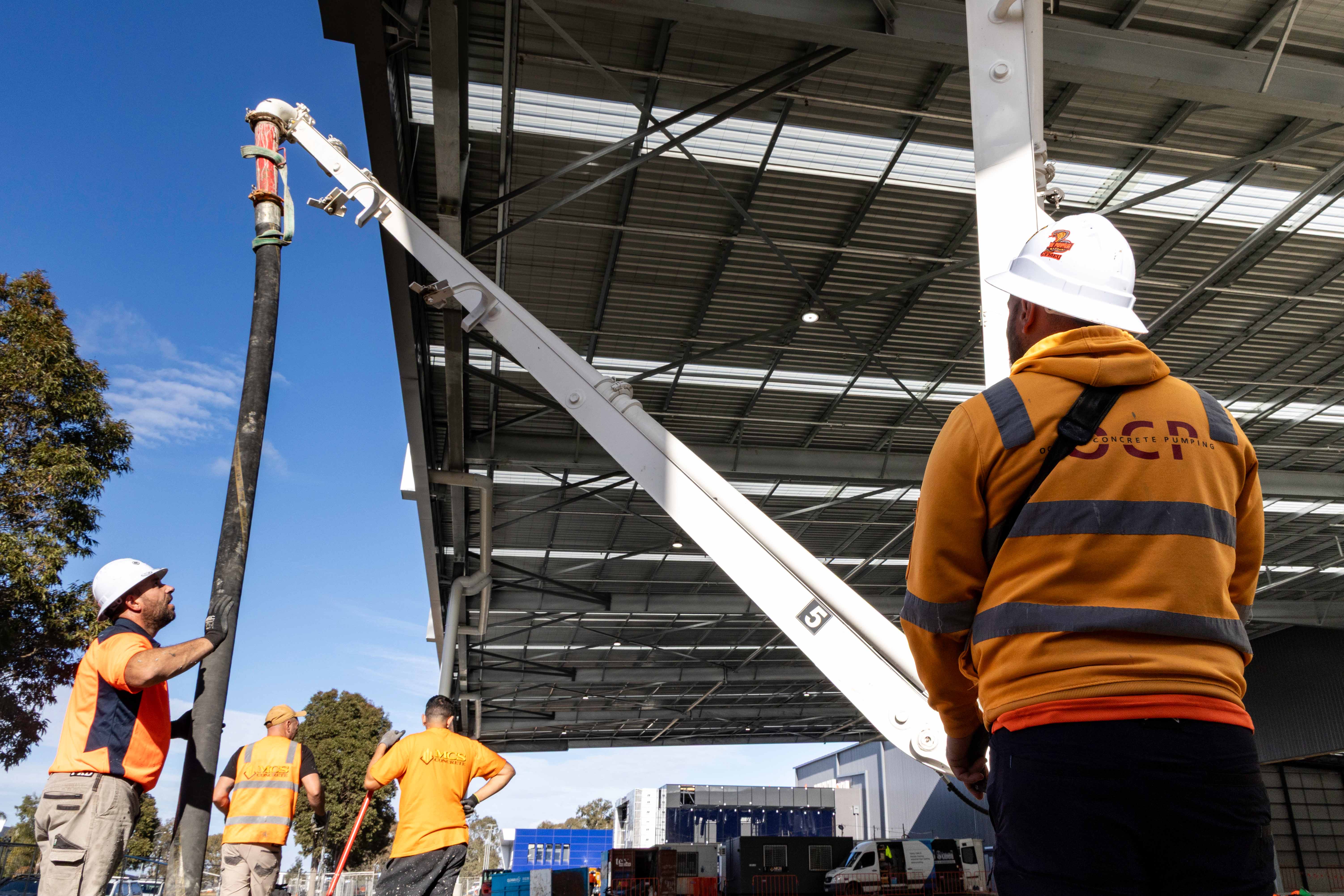 Oceana Concrete Pumping crew members working safely on a construction site in Melbourne.