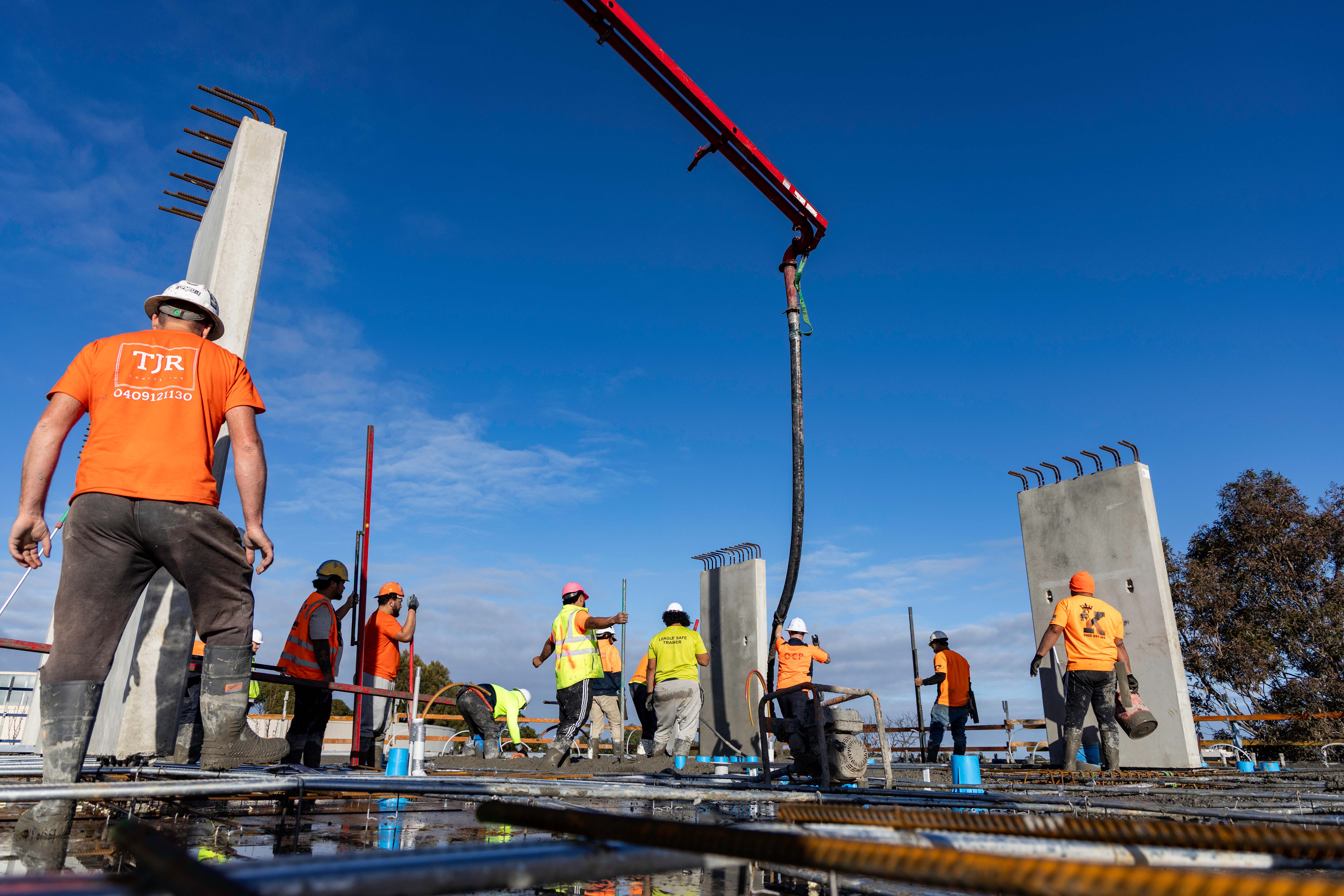 Oceana Concrete Pumping crew members working safely on a construction site in Melbourne.