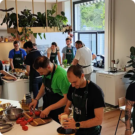 LogicStar AI team from diverse backgrounds bonding over cooking, fostering inclusion and collaboration while building autonomous AI solutions