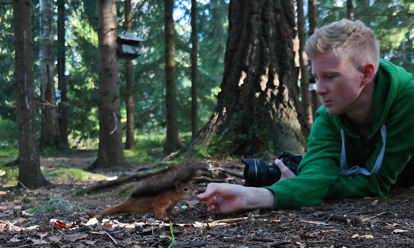 Konsta Punkka feeding a squirrel in Helsinki, Finland.