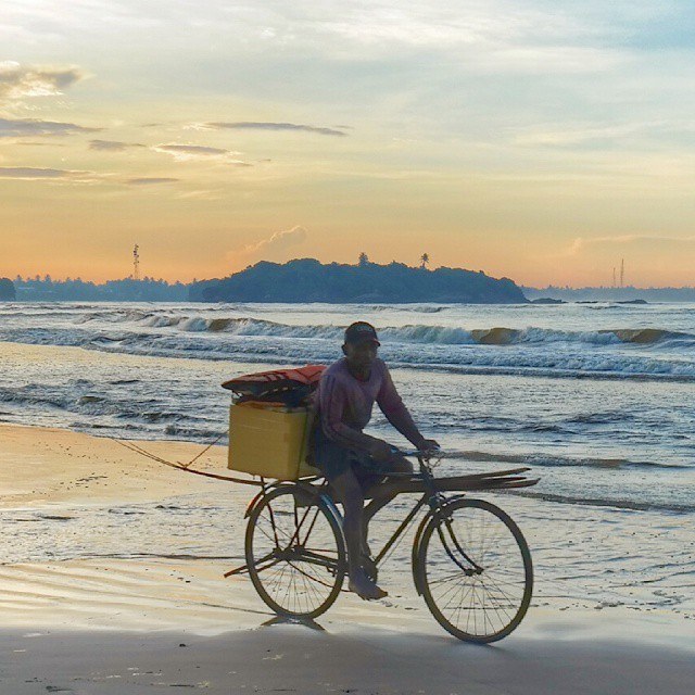 sri lanka beruwala beach fisherman going to work