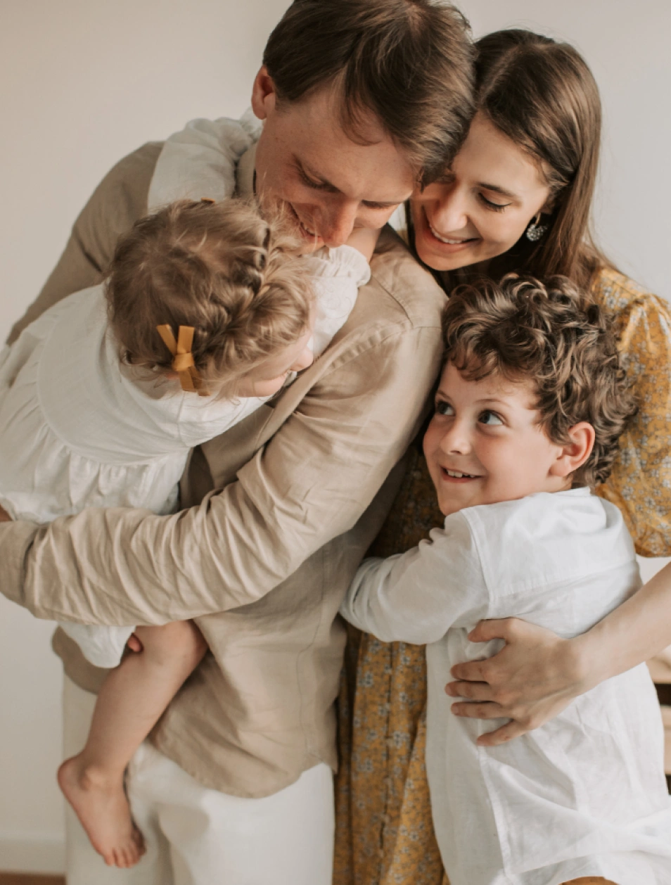 A joyful family group hug, reflecting compassionate, family-centered allergy and immune care at Global Allergy Immune Network in Murray, UT.