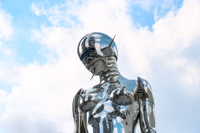 A robot with a silver head and torso.