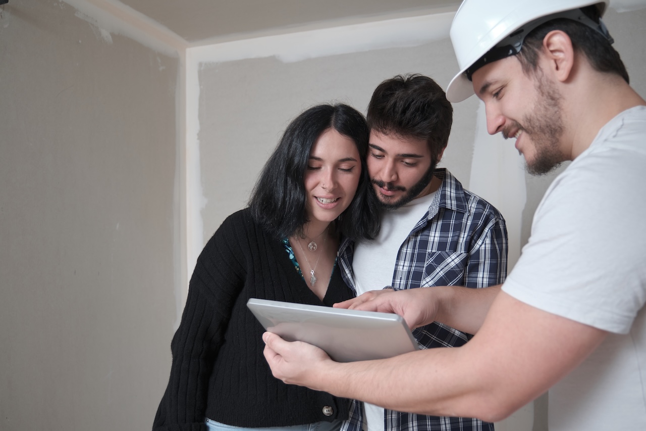 HVAC comfort advisor conducting an in-home sales call and reviewing recommendations with the homeowner.