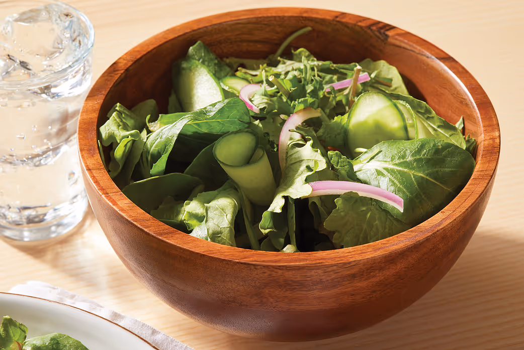 Bowl of fresh leafy greens, representing healthy produce innovation
