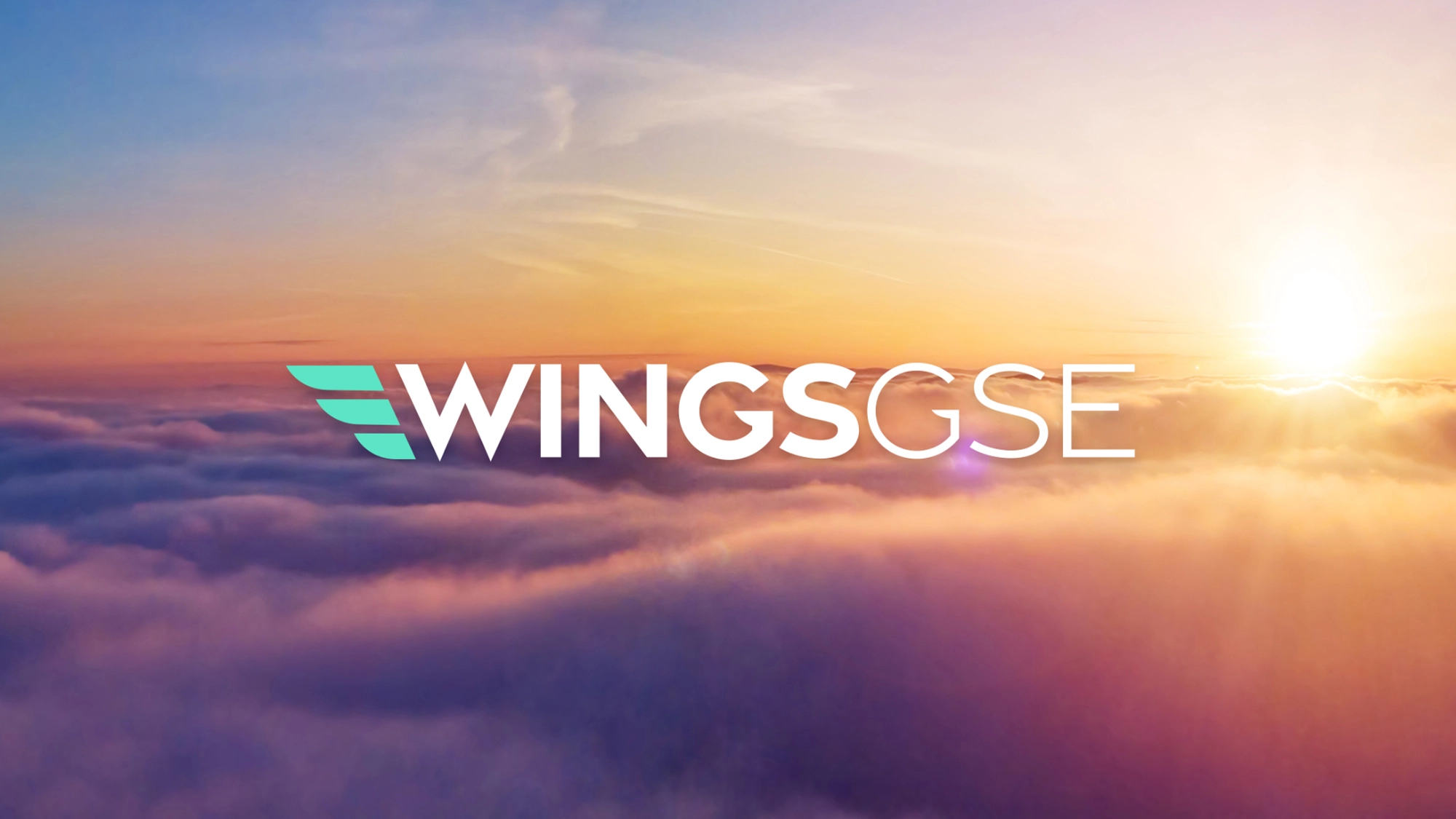 Wings GSE logo in sky blue and white on a sunset sky backdrop