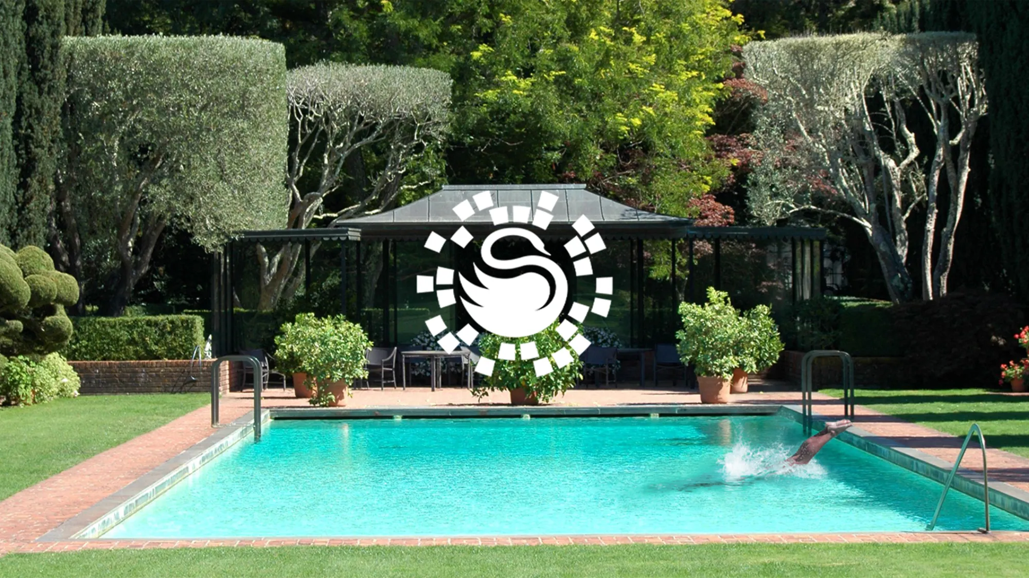 Surrey Swimming Pools logo in white on a background with an outdoor swimming pool and shaped hedges.