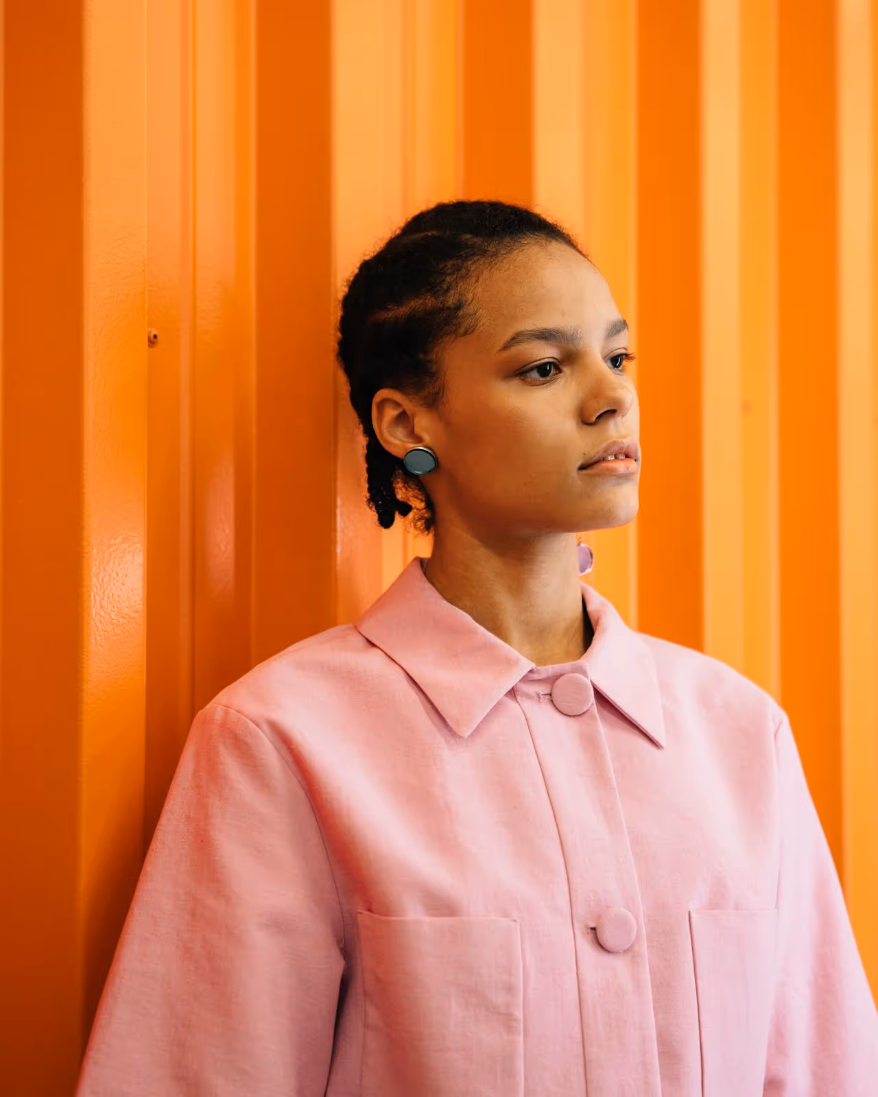 Image of a woman in a pink shirt.
