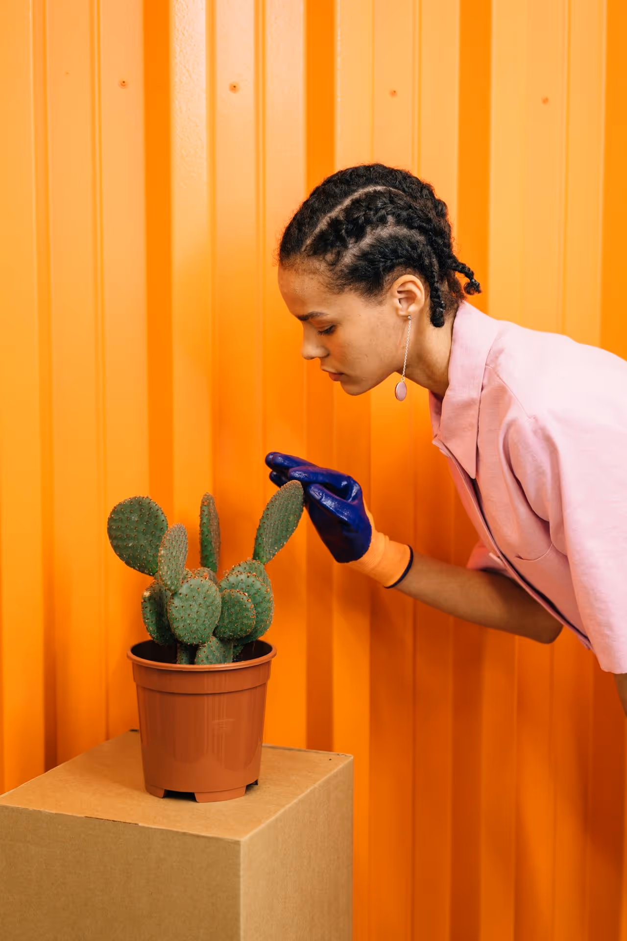 Woman touching a cactus.