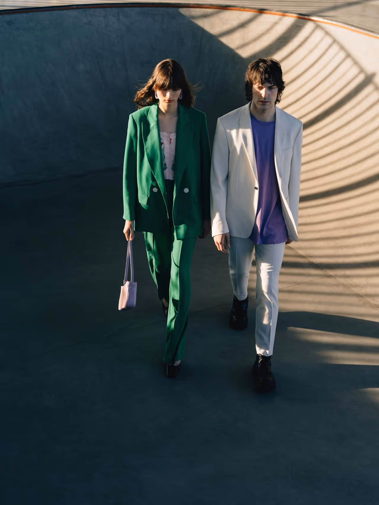Image of two models walking. 
