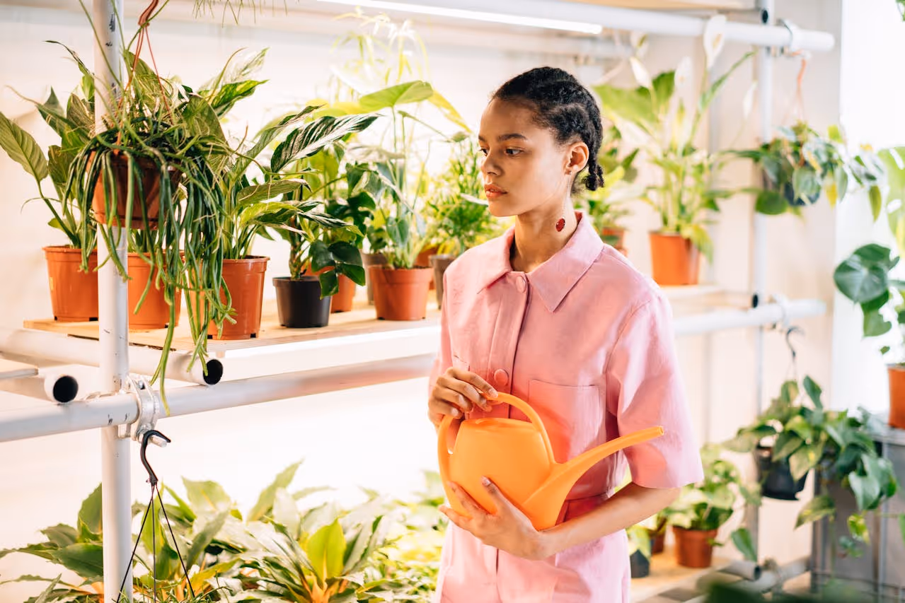 Woman watering plants.