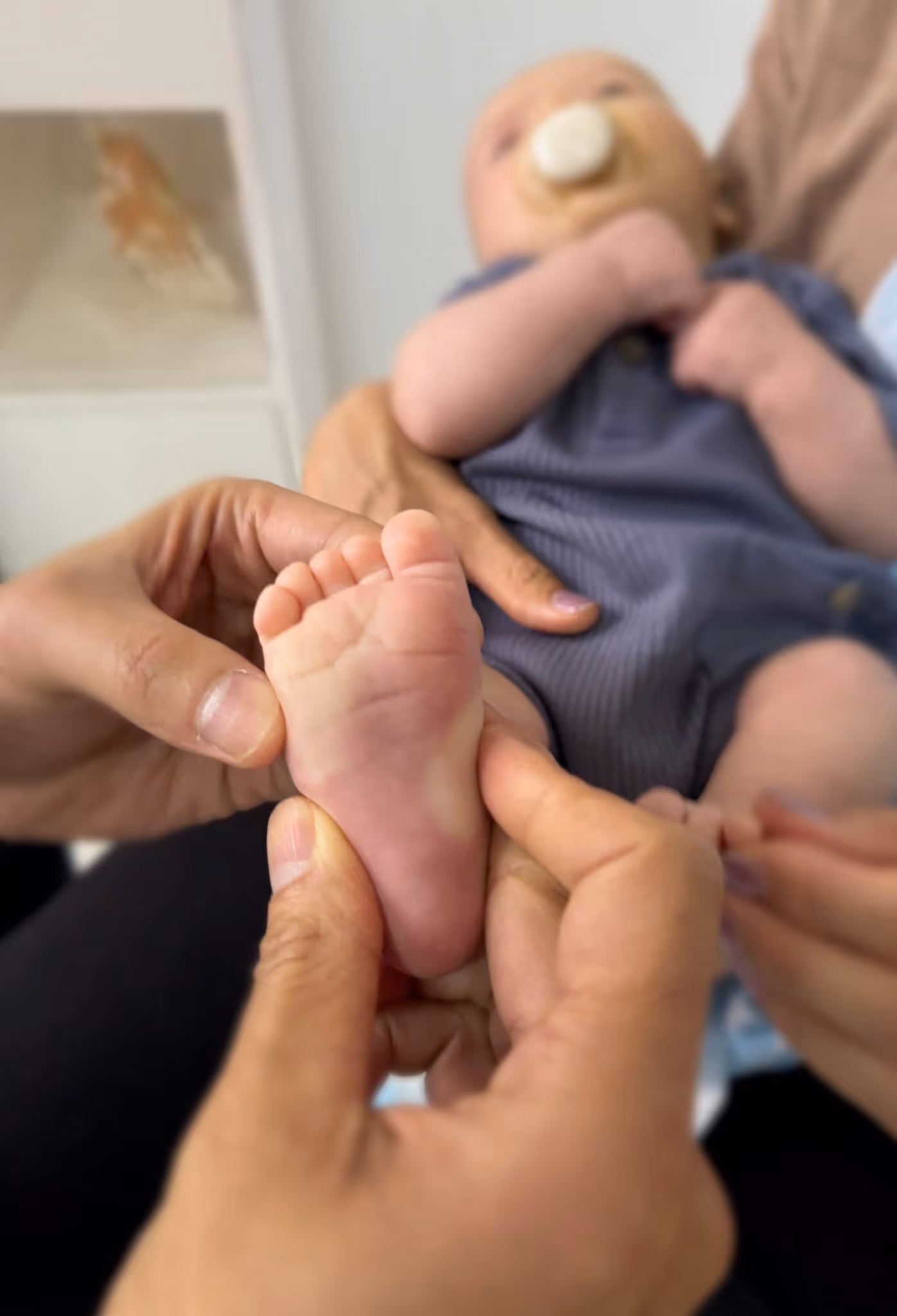 Paediatric osteopathy treatment at City Osteopathy showing gentle hands-on care for infant, demonstrating the clinic's Happy Melons Program and specialized osteopathic approach to supporting children's development and comfort from birth