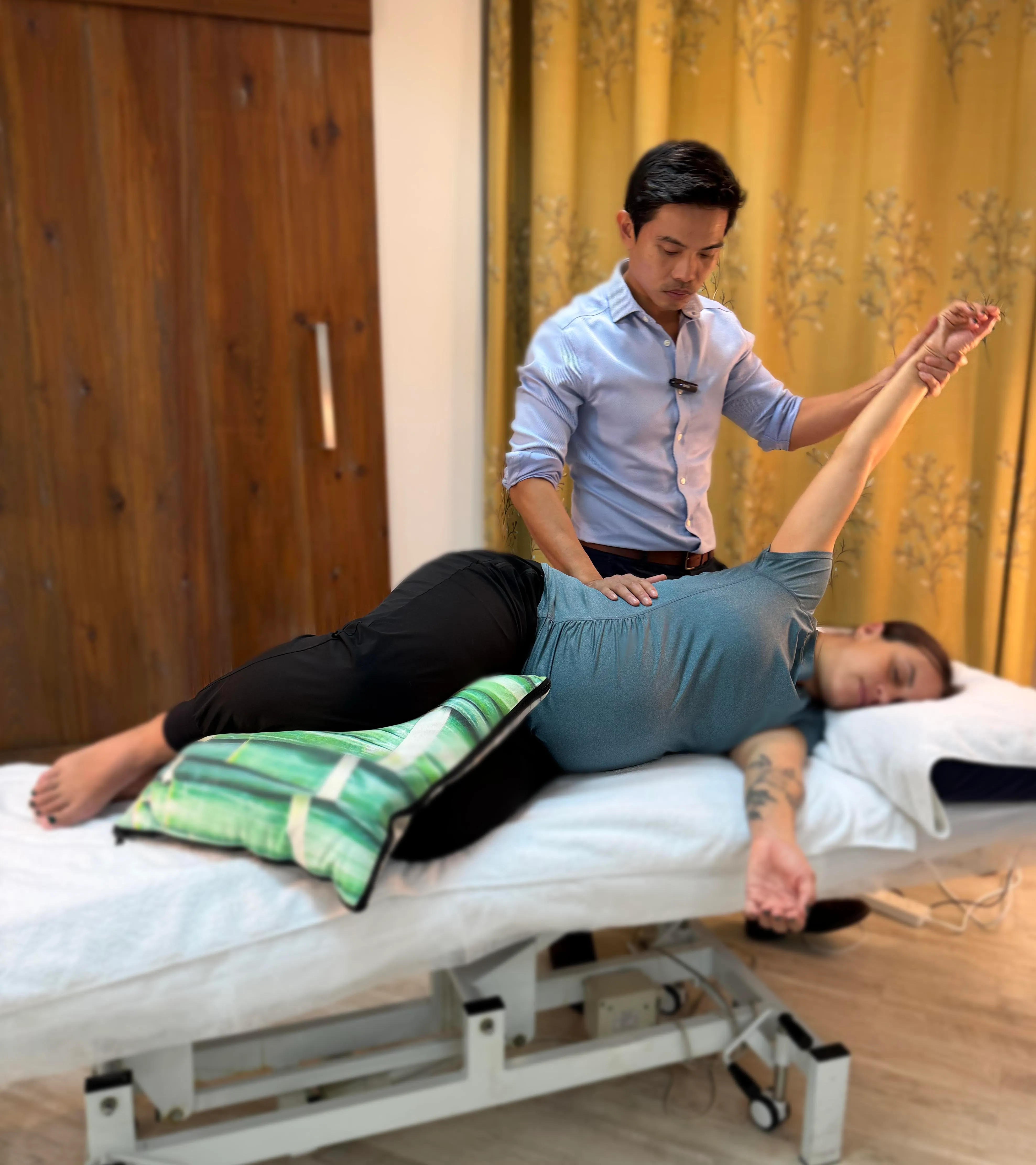 Osteopathic treatment at City Osteopathy showing practitioner performing manual therapy on patient's spine and back, demonstrating the clinic's hands-on approach for treating back pain, postural issues and spinal mobility