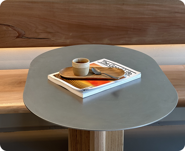 Espresso and reading moment on a minimalist indoor table.