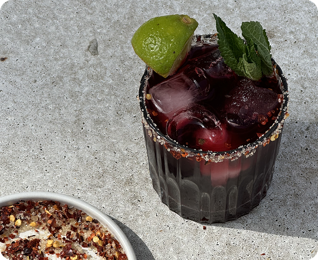 Icy summer drink with fresh mint and lime, served under the sun.