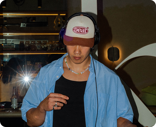 Live DJ spinning at Kosto, setting the mood with laid-back energy.