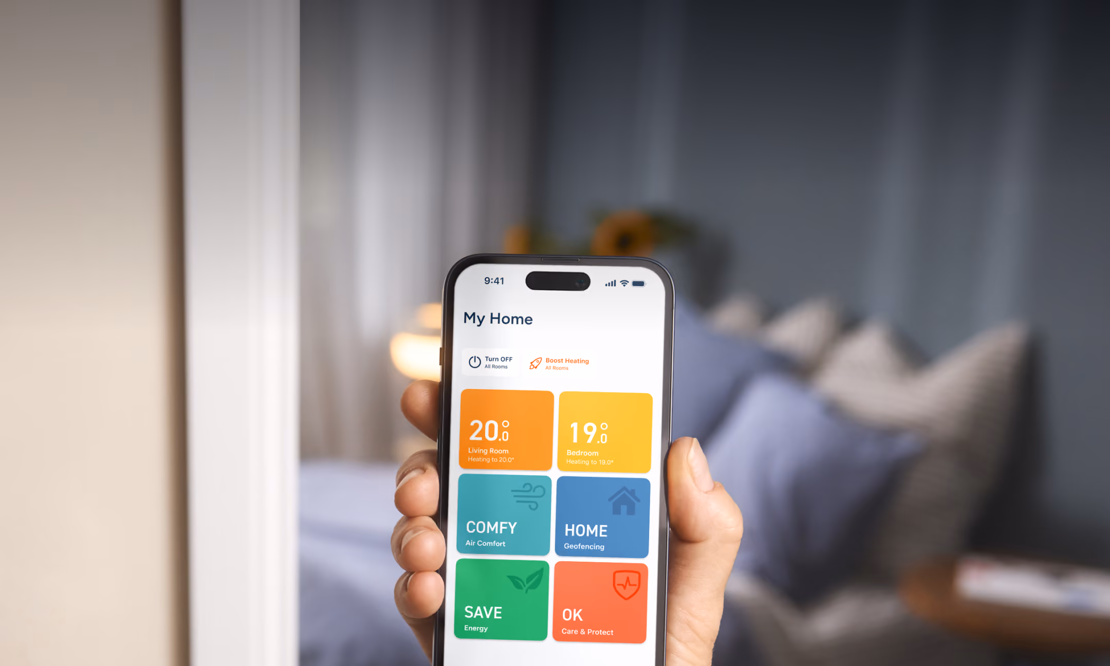 Person holding phone showing tado° app home screen