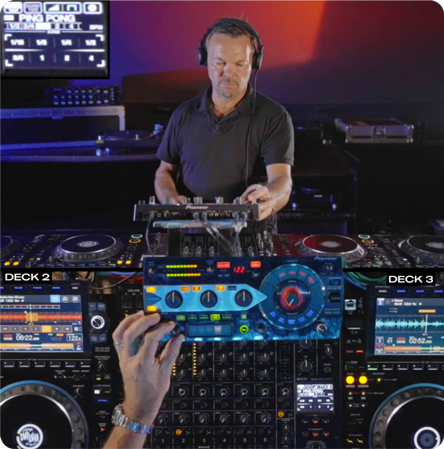 Pete Tong performing in a professional DJ setup with multiple decks, controllers, and a mixer. Close-up of hands adjusting effects and waveforms displayed on screens