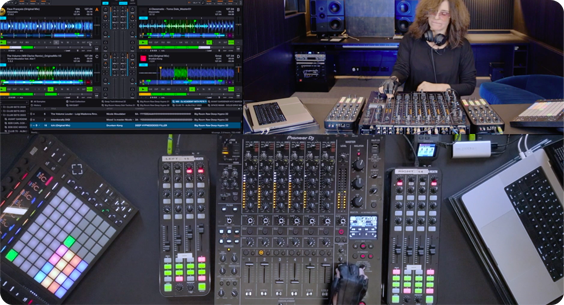 Nicole Moudaber performing in a professional studio with a mixer, controllers, and a laptop running DJ software. Multi-angle view shows equipment close-ups and waveform display on screen