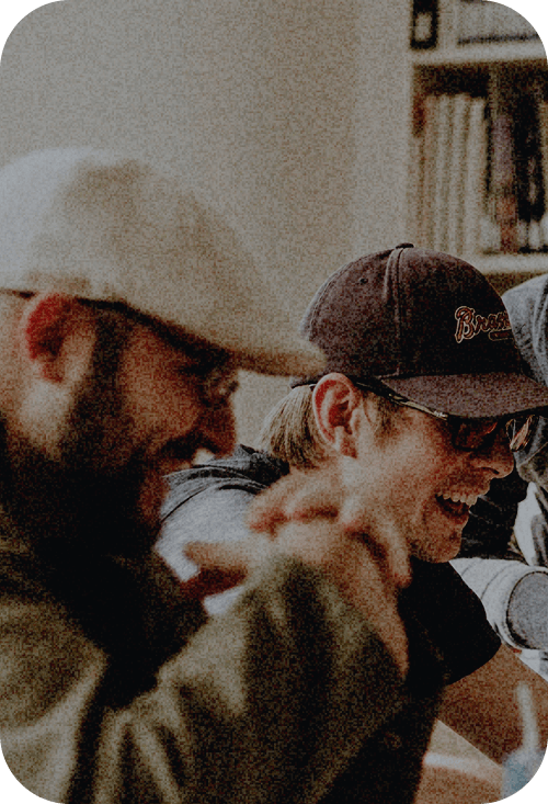 A group of men sitting next to each other.