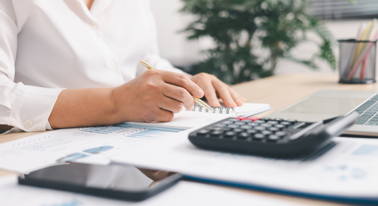 Accountant reviewing confidential financial and tax records