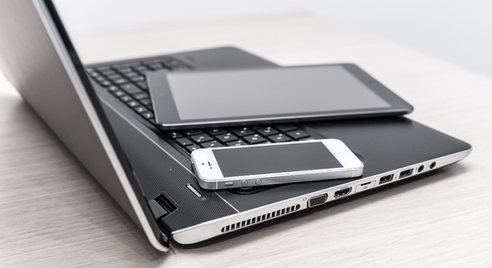 Laptop, tablet, and smartphone ready for electronics recycling