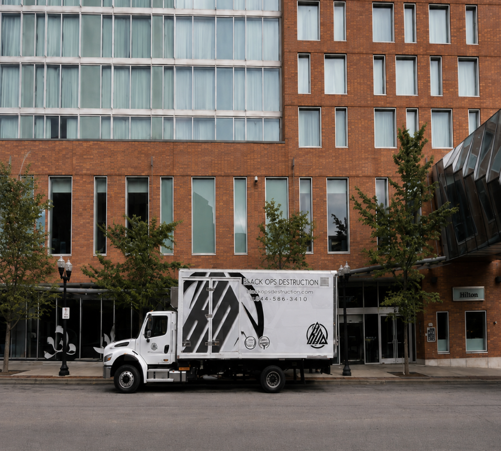 Black Ops Destruction secure document shredding truck parked outside a commercial building in Ohio