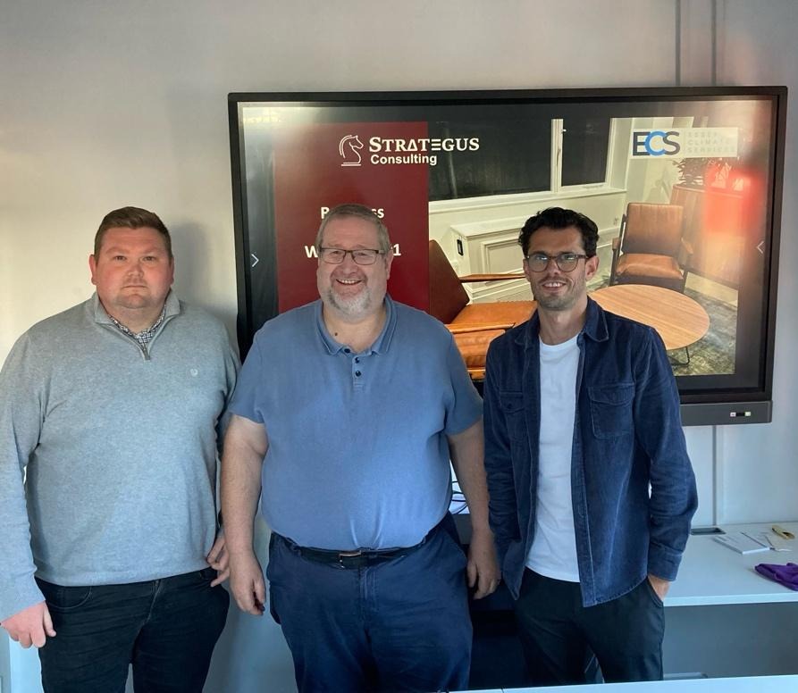 A group of men standing in front of a screenAI-generated content may be incorrect.