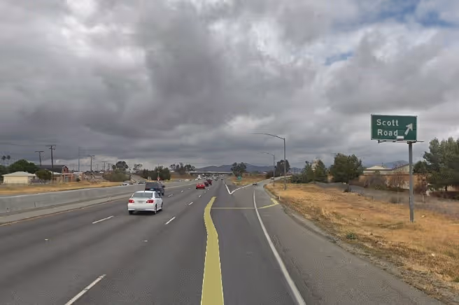 street level photo of a freeway with direction line