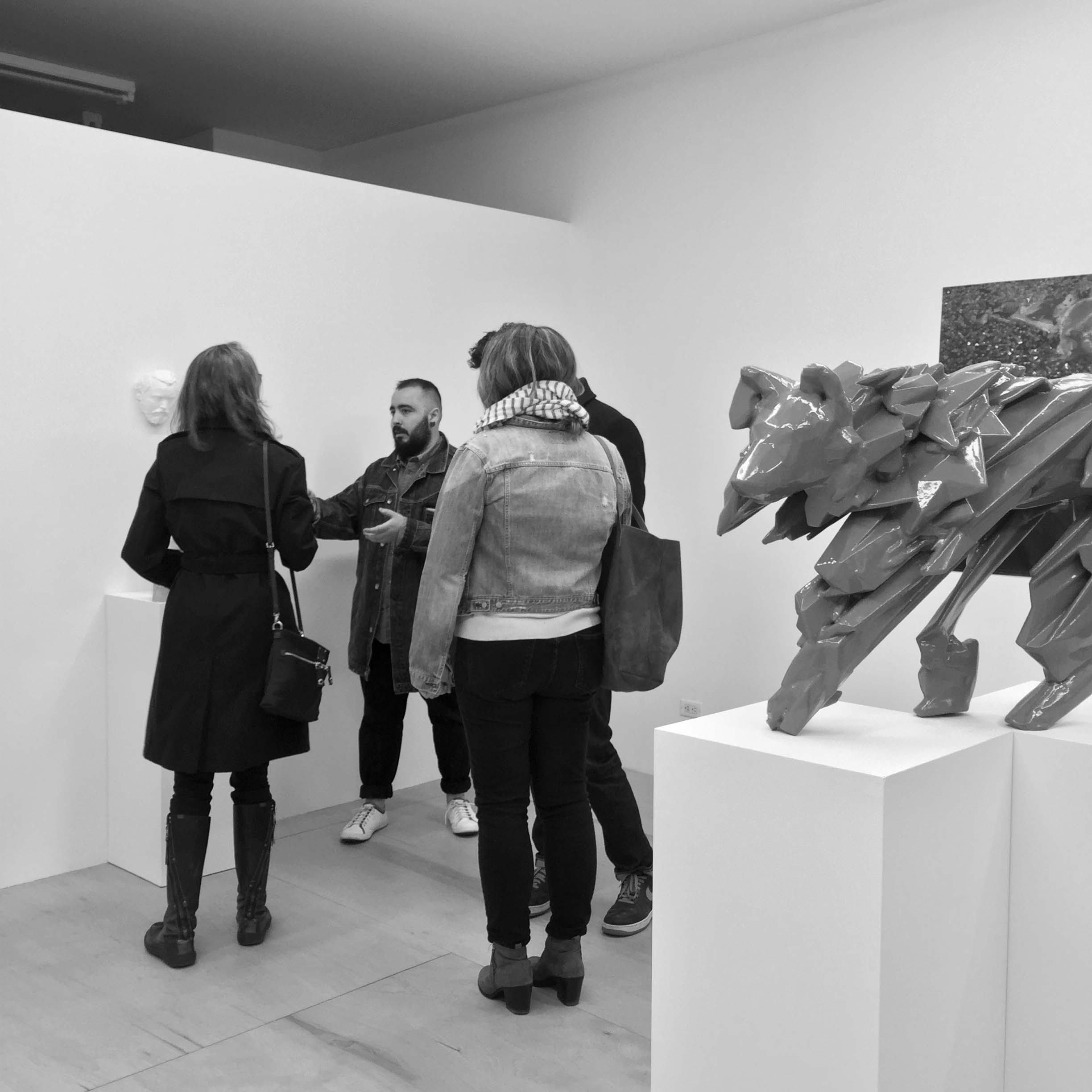 Adrian Edgard Rivera with visitors at opening reception