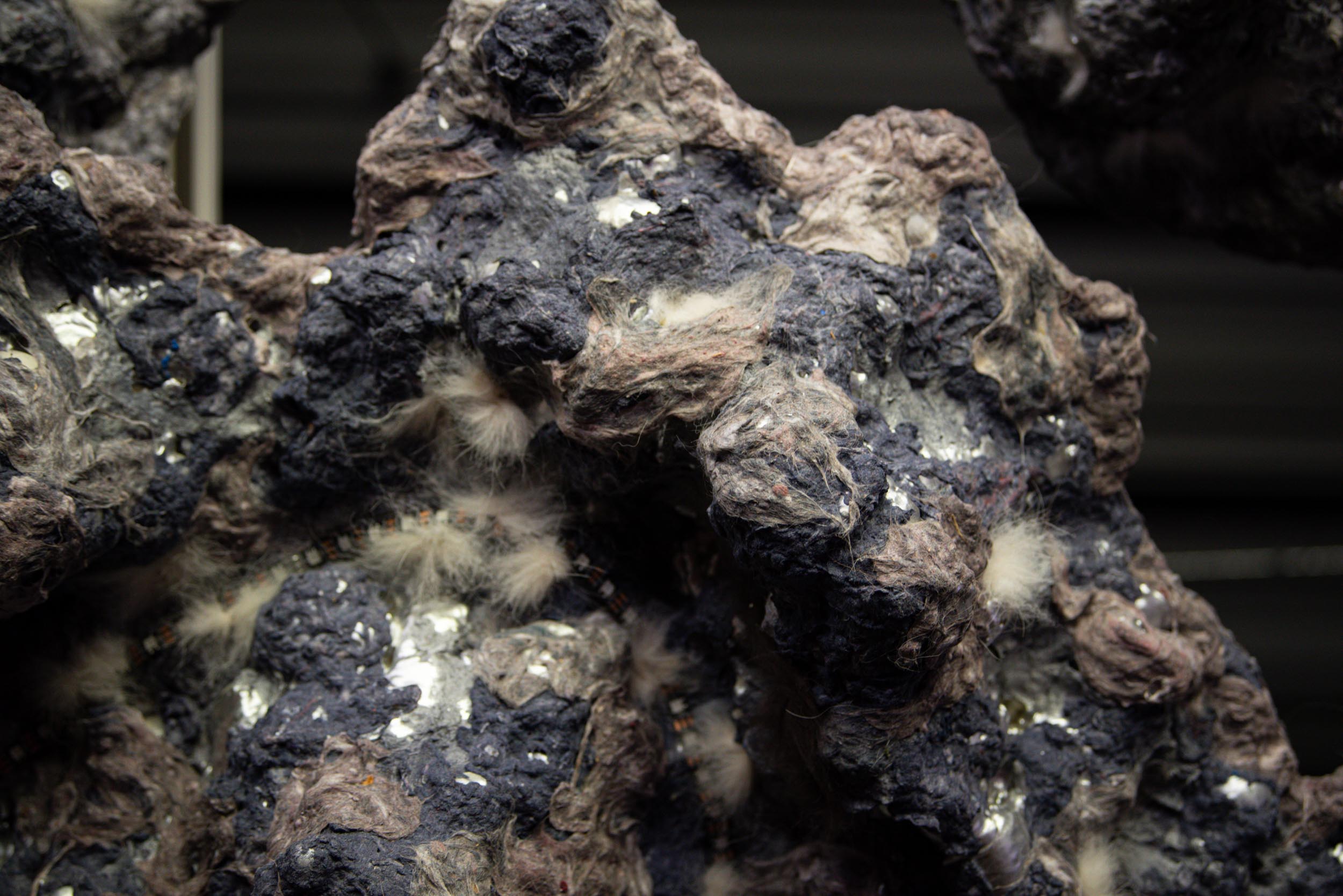 "The Cloud". 2026. multimedia installation with lights, motion sensors, microcontrollers, foam, dryer lint, hair.