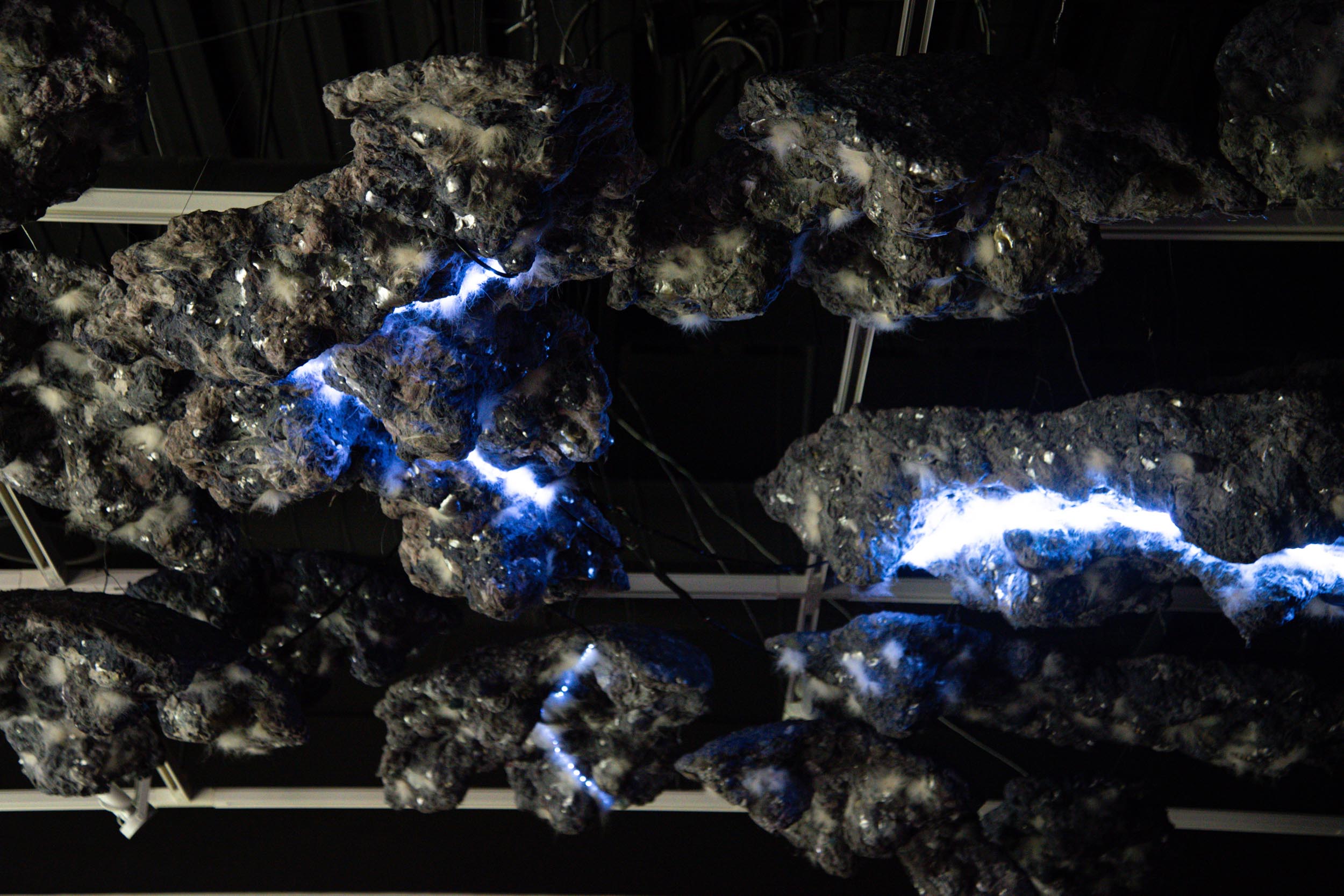 "The Cloud". 2026. multimedia installation with lights, motion sensors, microcontrollers, foam, dryer lint, hair.