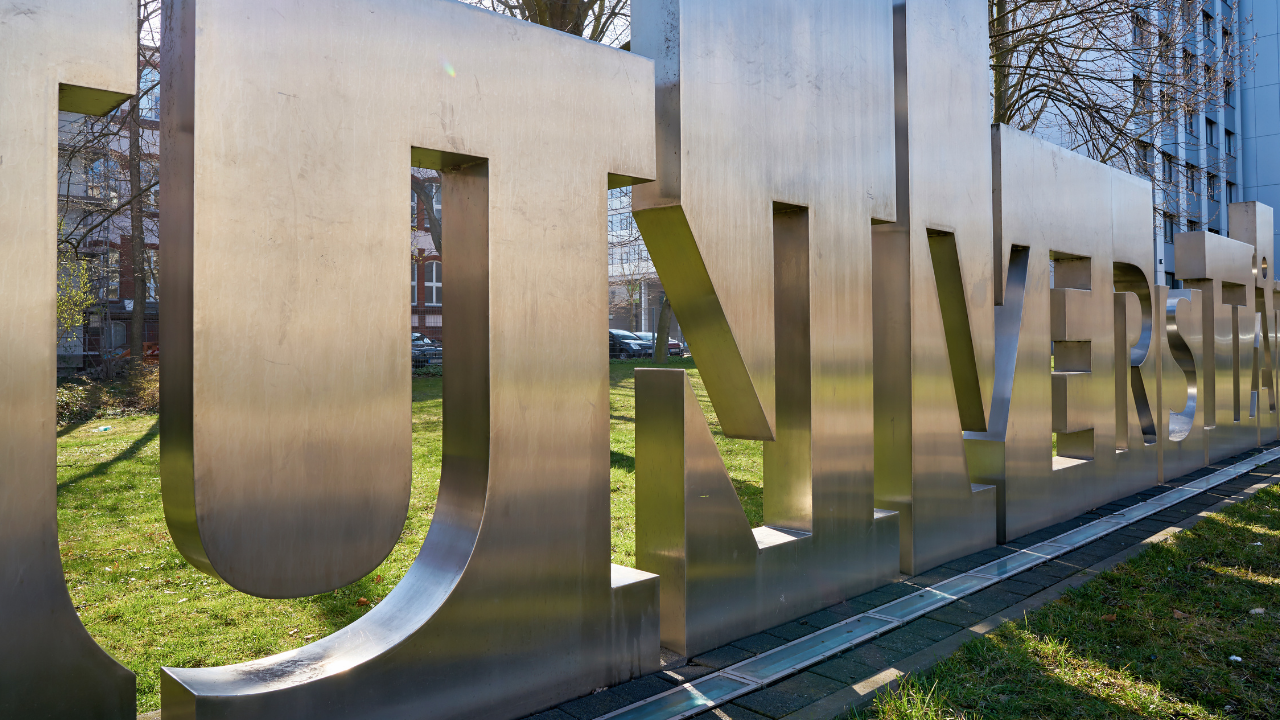 Metal sign that reads "University"