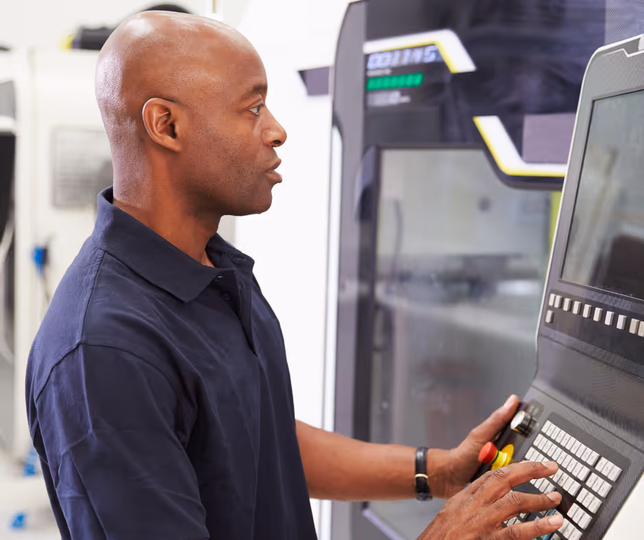 man looking at a machine