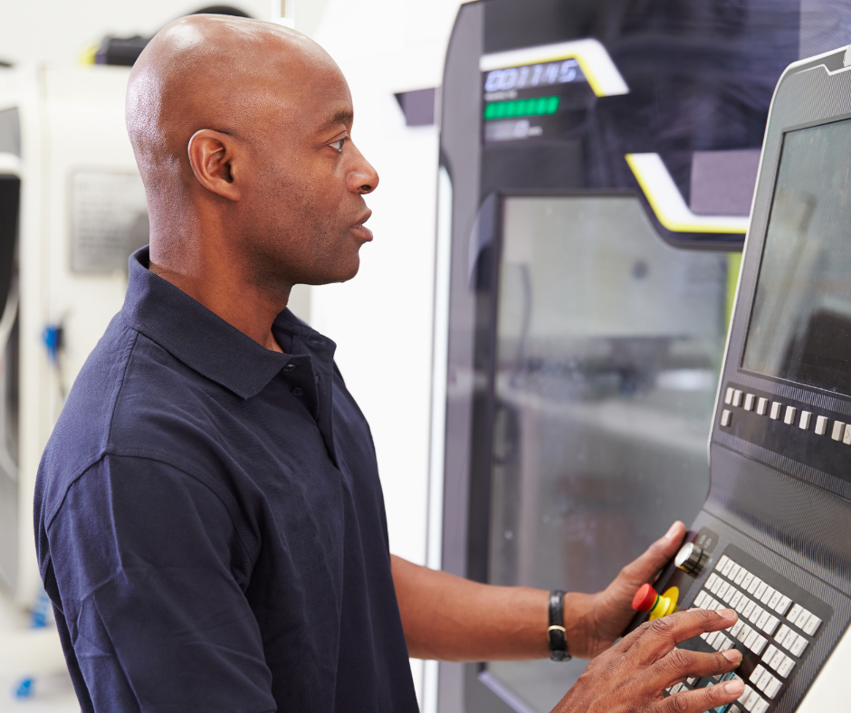 man looking at a machine