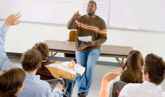 teacher calling on student with hand raised