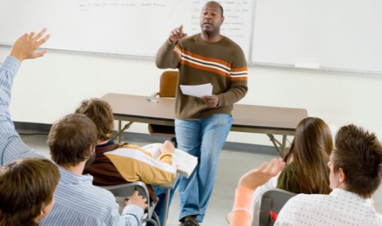 teacher calling on student with hand raised